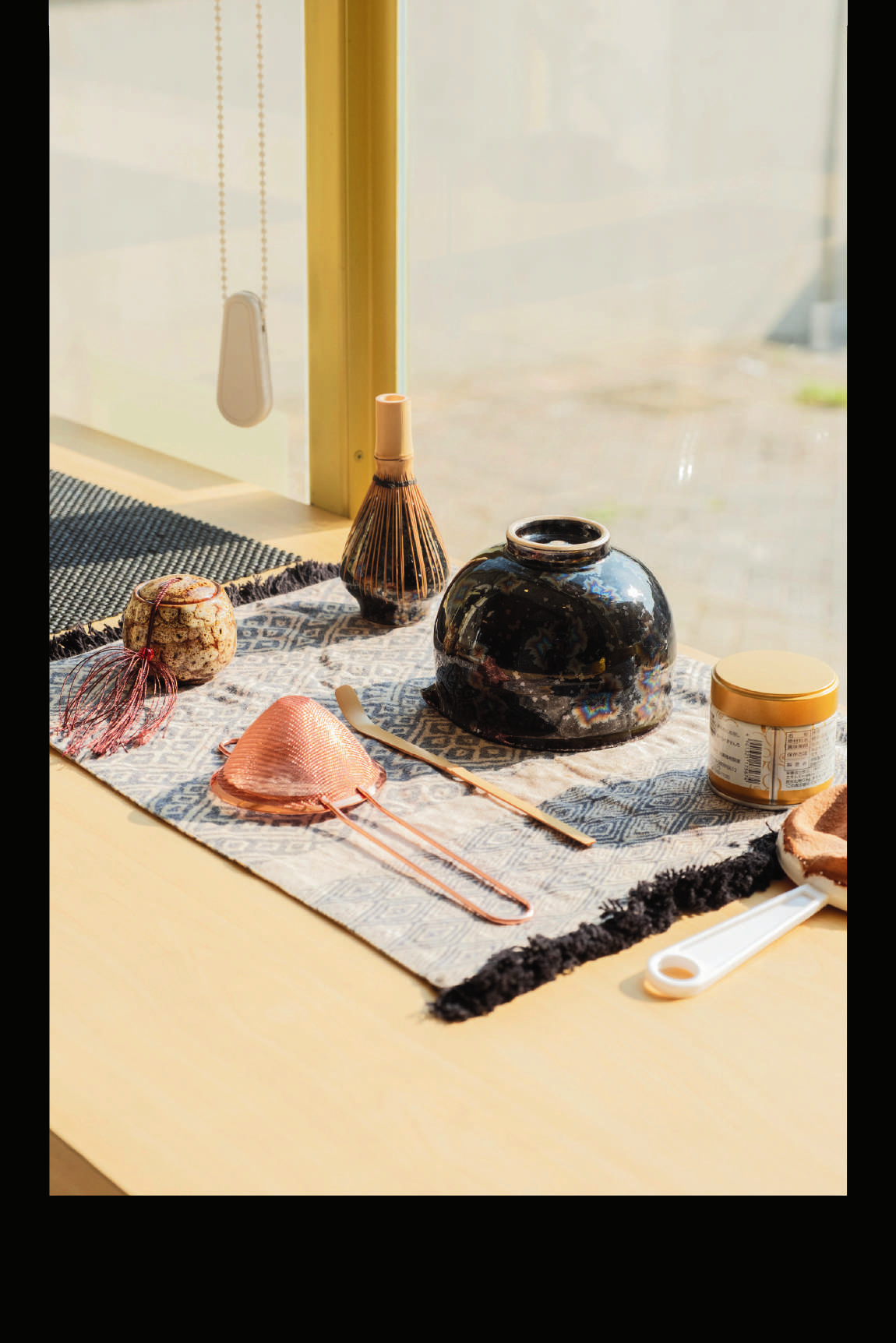 Artisanal matcha set — ceramic, dark glaze, woven fabric